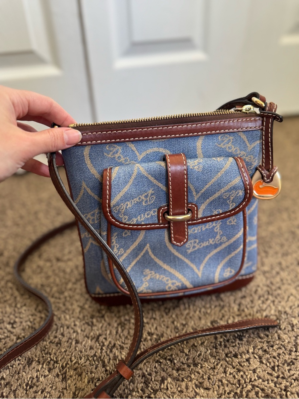 Dooney & Bourke Blue Denim Crossbody with Brown Leather Trim and Gold Charm